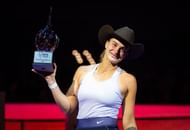 Aryna Sabalenka poses with the runner-up trophy at the 2022 WTA Finals